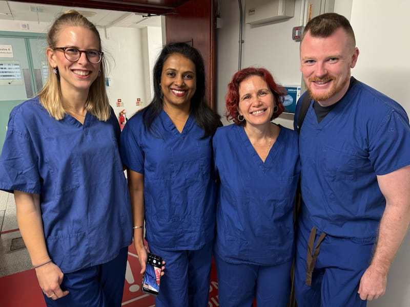 Chloe & Andrew in scrubs, with Paula and Anna from Hillingdon Hospitals NHS Trusts